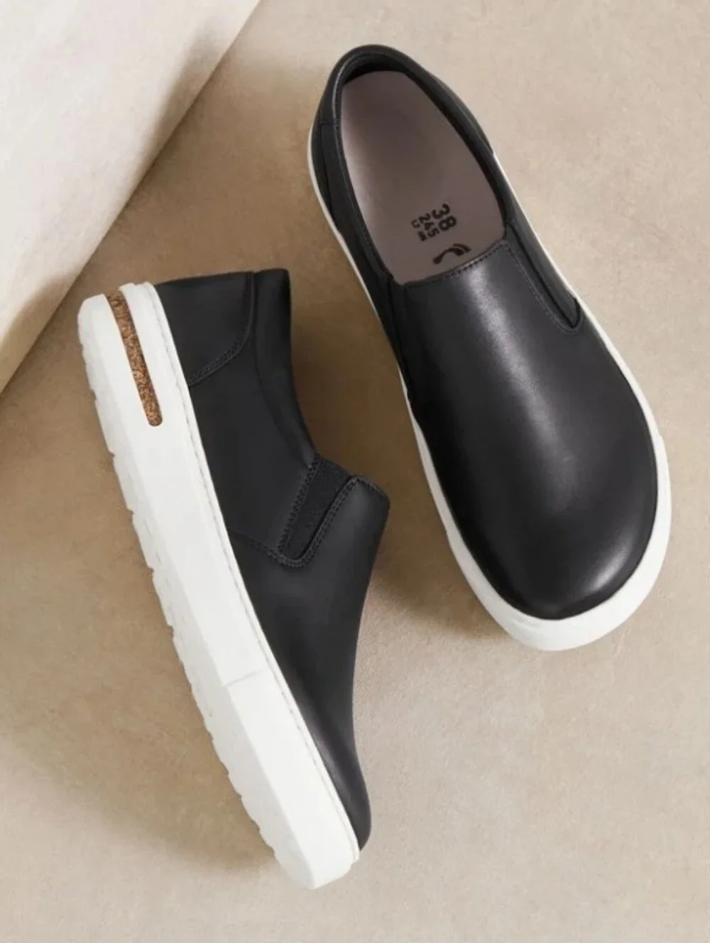 Birkenstock Oswego Women's Black Slip-On Leather Flats with White Sole 6N